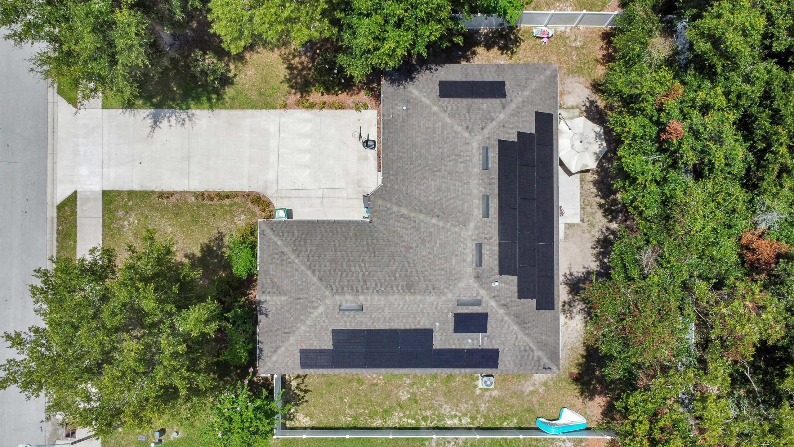 Aerial view of a 10.8kW solar energy system installed on the roof of a Deland, Florida home.