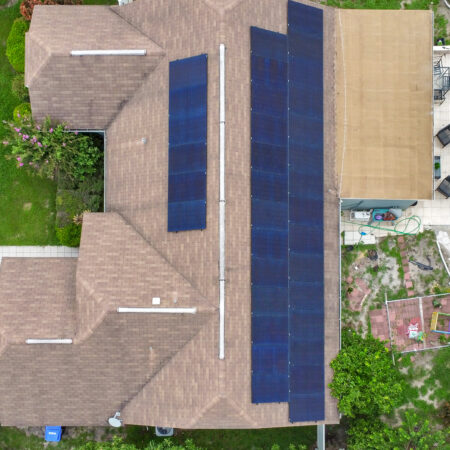 residential home in winter springs, florida with solar panels installed on the roof.