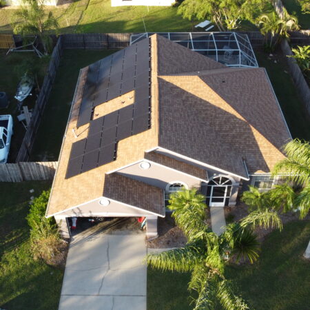 residential home with solar panels installed on the roof from a Port Orange solar company.